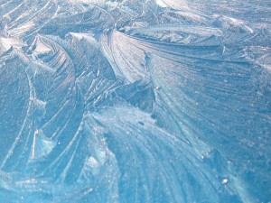 early morning sun lighting up ice crystals on roof of carf